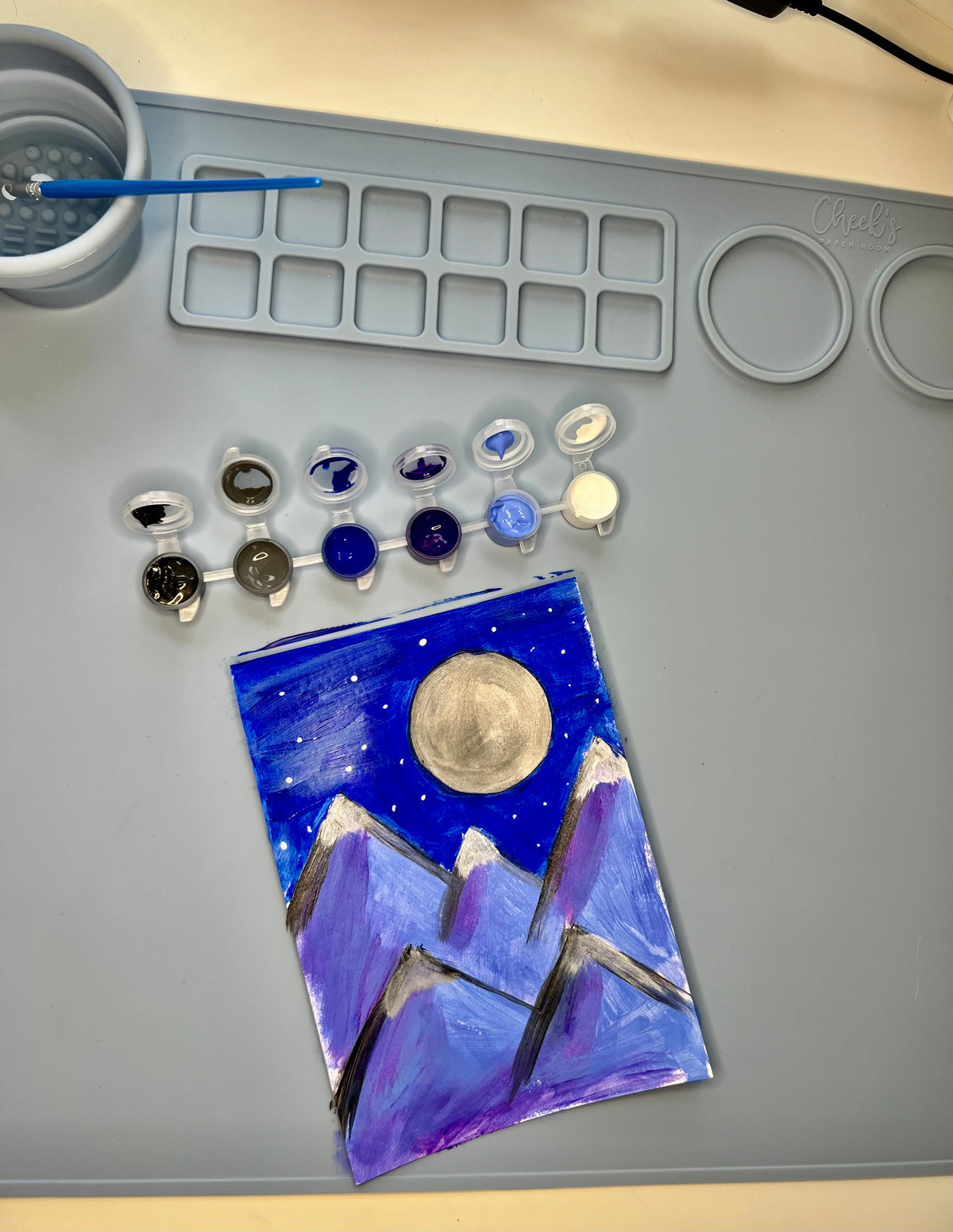 silicone art mat with paint brush painting blue moon